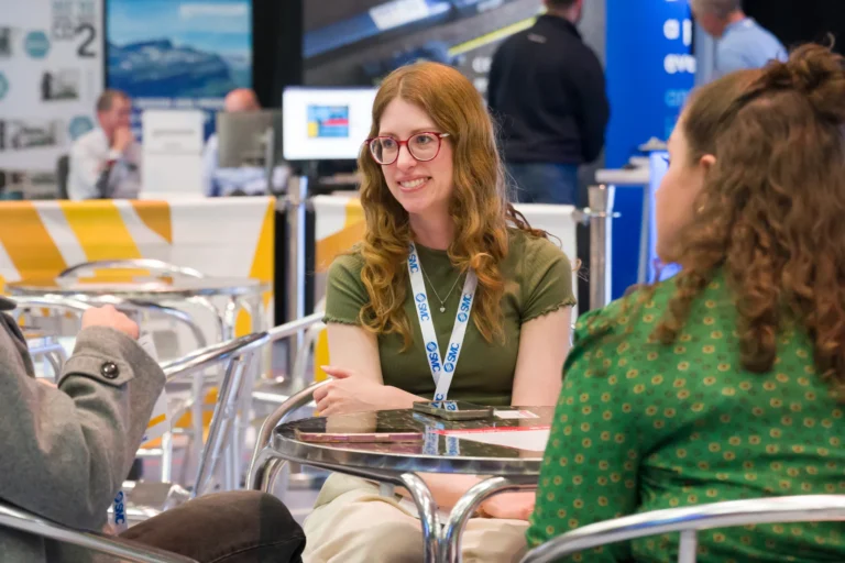 Delegates talking around a cafe table at the 2026 Sustainable Food Factory and Food+Beverage Engineering event.