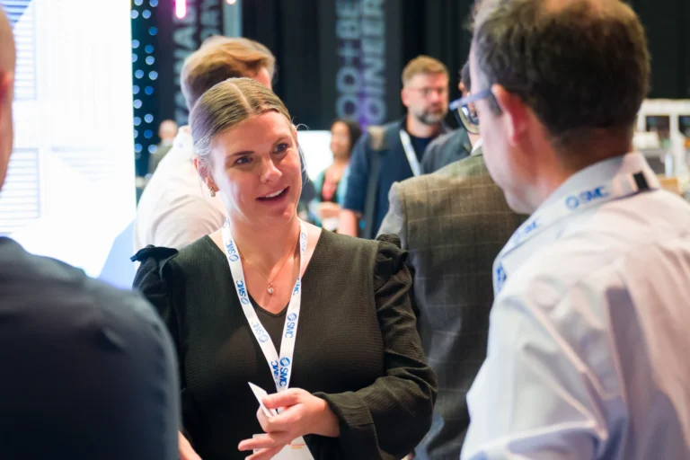 Delegates talking beside an exhibition stand at the 2026 Sustainable Food Factory and Food+Beverage Engineering event.