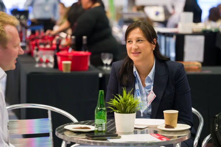 Visitor taking a break at a cafe table at the 2026 Sustainable Food Factory and Food+Beverage Engineering event.